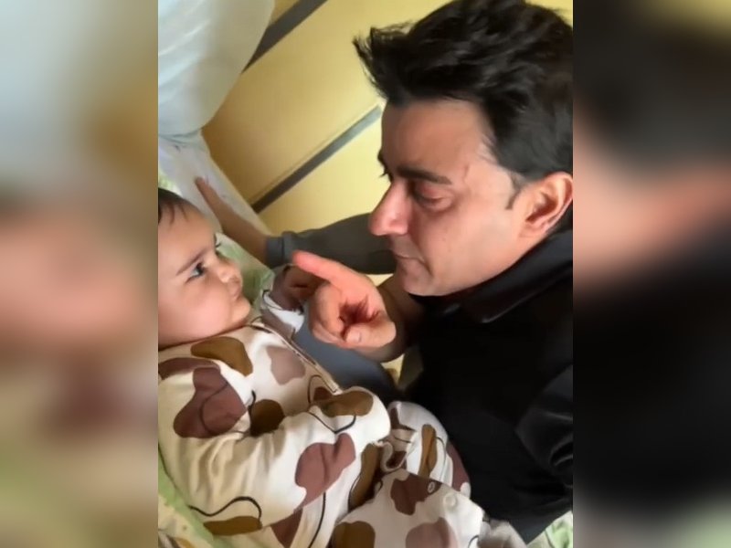 Gautam Rode has a playful tussle with his adorable little one
