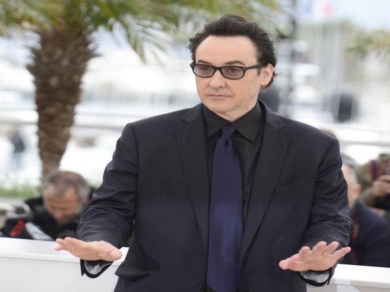 John Cusack reveals the effort behind his iconic boombox scene in ‘Say Anything’ after 35 years.