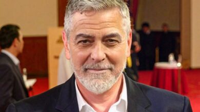 George Clooney recalls his first kiss at 11 in a Kentucky church while hiding from friends.